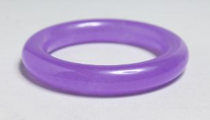 A CHINESE LAVENDER JADE BANGLE, 3.5ins diameter.