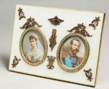 A SUPERB RUSSIAN SILVER AND ENAMEL DOUBLE PHOTOGRAPH FRAME with portrait prints of Alexander II &