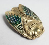 A BRASS ENAMEL INSECT VESTA.