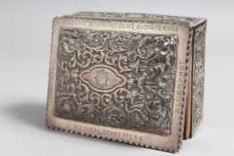 A VICTORIAN SILVER REPOUSSE DECORATED CIGARETTE BOX, 4.5ins, inscribed, presented to the Medical