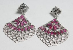 A PAIR OF SILVER, RUBY AND MARCASITE DECO DESIGN EARRINGS.