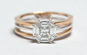 AN 18CT WHITE GOLD AND ROSE GOLD DIAMOND CLUSTER RING.