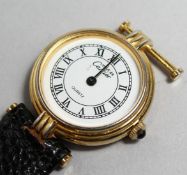 A LADIES CARTIER SILVER GILT WRIST WATCH (strap A/F).