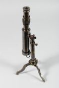 A BRASS TELESCOPE on tripod stand. 9ins long.