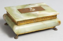 AN ONYX CIGARETTE BOX on four claw feet, Pakistan Armed Forces. 7ins long,