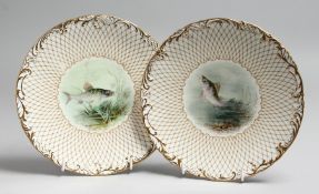A PAIR OF WEDGWOOD PLATES painted with named fish by J. H. PLANT, signed, retailed by Higgins &