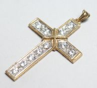A GOOD 9CT GOLD CZ CROSS PENDANT.
