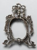 A SMALL ROCOCCO STYLE SILVER PHOTOGRAPH FRAME, 4ins high.