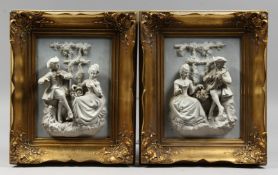 A PAIR OF GILT FRAMED BISQUE PLAQUES of a gallant and a young lady. 9ins x 6.5ins.
