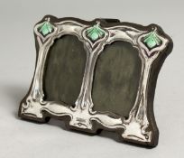 A SMALL PAIR OF SILVER AND BLUE ENAMEL DOUBLE PHOTOGRAPH FRAMES. 3ins x 4ins.
