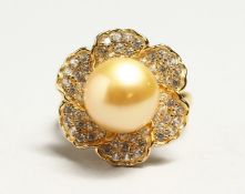 A SILVER GILT PEARL AND CZ RING.