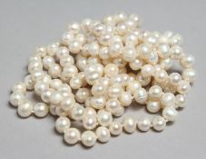 A LONG STRING OF WHITE PEARLS, 45ins long.
