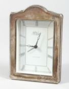 AN R. CARR SILVER CASED CLOCK 7ins high.