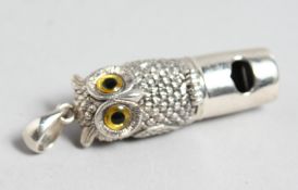 A CAST SILVER OWL'S HEAD WHISTLE,1.5ins long.