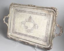 A LARGE VICTORIAN GOLDSMITHS & SIVERSMITHS CO., RECTANGULAR TWO HANDLED TEA TRAY, with cast border