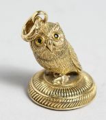 A GOLD PLATED OWL SEAL.
