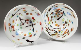 A PAIR OF LARGE MODERN CIRCULAR SHALLOW DISHES, white opaque ground with colourful decoration. 1ft
