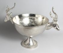 A CAST METAL CIRCULAR WINE COOLER WITH STAG HEAD HANDLES, 17ins high.