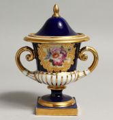 A 19TH CENTURY CHAMBERLAINS WORCESTER VASE AND COVER painted with flowers in raised gilt panel on