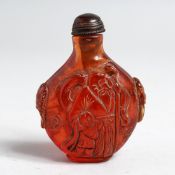 A CHINESE AMBER STYLE SNUFF BOTTLE, 3ins high.