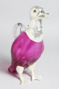 A PLATED AND CRANBERRY COLOURED GLASS DUCK CLARET JUG, 10ins high.