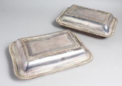 A PAIR OF IRISH PLATED RECTANGULAR ENTRÉE DISHES AND COVERS with gadrooned rims.