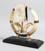 A SILVER AND HORN MATCH HOLDER TABLE CENTREPIECE on oblong base, London 1913, 7ins high, with
