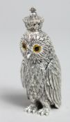 A NOVELTY WHITE METAL OWL WITH A CROWN, PERFUME BOTTLE, 3.5ins high.