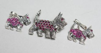 A SILVER, RUBY SET SCOTTIE DOG BROOCH AND CUFF LINKS.