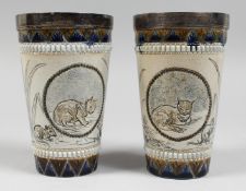 A SUPERB PAIR OF HANNAH BARLOW DOULTON STONEWARE TAPERING BEAKERS with silver lips, Birmingham,