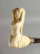 A WALKING STICK WITH BONE HANDLE OF A NUDE. 34ins long.