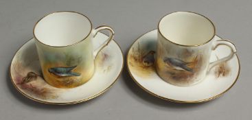A ROYAL WORCESTER COFFEE CAN AND SAUCER painted with a wood pigeon or a snipe by Jas Stinton.