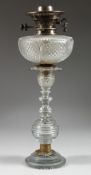 A GOOD CUT GLASS OIL LAMP 18ins high.
