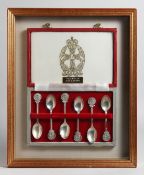 A CASED SET OF SIX SILVER TEA SPOONS WITH Q A R A M C. CREST ON THE HANDLE.
