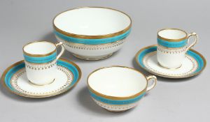 AN 19TH CENTURY MINTON COFFEE CUP, TEACUP AND SAUCER with turquoise and gold jewelied band under a