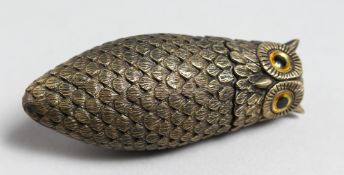 A BRASS OWL VESTA CASE with glass eyes, 3ins high.