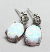 A PAIR OF SILVER AND OPAL EARRINGS.