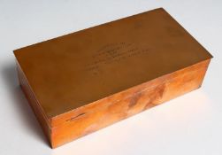 A COPPER RECTANGULAR CIGARETTE BOX, 7ins wide engraved; PRESENTED TO HEADQUARTERS MESS RAMC. MAJOR