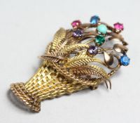 A GOLD AND MULTI-GEM SET BROOCH MODELLED AS A BASKET OF FLOWERS, 2ins high.