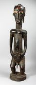 A LARGE FANG STYLE CARVED WOOD STANDING MALE FIGURES 32ins high