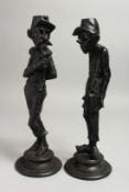 A PAIR OF 19TH CENTURY SPELTER FIGURES on circular bases. 13ins high.