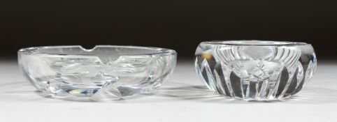 A HEAVY BACCARAT CIRCULAR GLASS ASHTRAY, 4ins diameter, and ANOTHER, 5ins diameter. (2).