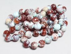 A LONG STRING OF FACET CUT AGATE BEADS, 44ins long.