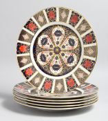 A SET OF SIX LARGE ROYAL CROWN DERBY OLD IMARI PATTERN CIRCULAR PLATES, no. 1128. 10.5ins high.