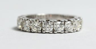 A VERY GOOD 18CT WHITE GOLD 4.20CT DIAMOND ETERNITY RING.