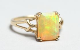 A GOLD AND OPAL RING.