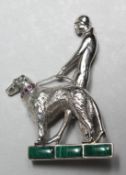 A SILVER MARCASITE AND RUBY SET DECO STYLE LADY WITH DOG.