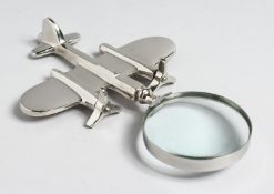 A MAGNIFYING GLASS with AEROPLANE handle.