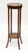 AN EDWARDIAN INLAID MAHOGANY TWO TIER CIRCULAR JARDINIERE STAND. 1ft 1ins diameter x 3ft 2ins high.