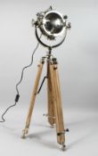AN INDUSTRIAL STYLE SPOTLIGHT FLOOR STANDING LAMP on tripod base.